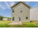 Exterior back of home with siding, green lawn, patio, and door at 5567 Union Pointe Pl, Union City, GA 30291