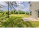 Spacious backyard with lush greenery, concrete patio and a treed boundary for privacy and outdoor enjoyment at 5567 Union Pointe Pl, Union City, GA 30291