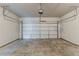 Spacious two car garage featuring a concrete floor and white garage door at 5567 Union Pointe Pl, Union City, GA 30291