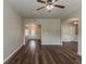 Spacious hallway featuring hardwood floors connecting to the dining room, living room, and front entry at 5567 Union Pointe Pl, Union City, GA 30291
