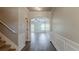 Bright hallway features wainscoting and hardwood floors which provides a seamless transition to living areas at 5567 Union Pointe Pl, Union City, GA 30291