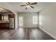 Open-concept living room featuring hardwood floors and seamlessly connected kitchen and outdoor access at 5567 Union Pointe Pl, Union City, GA 30291