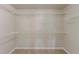 Spacious walk-in closet with multiple wire shelving units for optimal organization at 5567 Union Pointe Pl, Union City, GA 30291