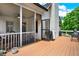 Back porch area with outdoor seating area with easy access to grill at 104 Meadow View Trl, Canton, GA 30115