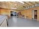 Unfinished basement with exposed insulation and plywood walls, ready for personalization at 104 Meadow View Trl, Canton, GA 30115