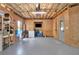 Unfinished basement with plywood walls and open ceiling, offering potential for customization and additional living space at 104 Meadow View Trl, Canton, GA 30115