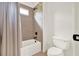 Cozy bathroom features a tub and shower combination with tan tiling and modern fixtures at 104 Meadow View Trl, Canton, GA 30115