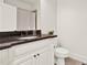 Bathroom vanity features granite countertop, classic white cabinetry, and updated fixtures at 104 Meadow View Trl, Canton, GA 30115