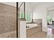 Bathroom showcases a luxurious walk-in shower and separate soaking tub near shuttered windows at 104 Meadow View Trl, Canton, GA 30115