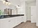 Bright bathroom features a double vanity with granite countertops and white cabinetry at 104 Meadow View Trl, Canton, GA 30115