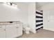 Bright and clean bathroom features a vanity with marble countertop, ample lighting, and modern fixtures at 104 Meadow View Trl, Canton, GA 30115