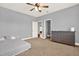 The bonus room can double as a guest bedroom with a bed, large window, and a dresser for storage at 104 Meadow View Trl, Canton, GA 30115