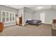 Spacious bedroom features a large window and neutral tones, creating a calming atmosphere at 104 Meadow View Trl, Canton, GA 30115
