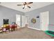 This versatile bonus room includes both an arcade game and a dartboard and is naturally lit at 104 Meadow View Trl, Canton, GA 30115