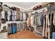 Spacious walk-in closet features custom shelving, hardwood floors, and ample storage space at 104 Meadow View Trl, Canton, GA 30115