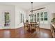 Light-filled dining room featuring hardwood floors and large windows with plantation shutters at 104 Meadow View Trl, Canton, GA 30115