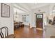 Welcoming entryway with hardwood floors, white trim and a view into the dining room at 104 Meadow View Trl, Canton, GA 30115