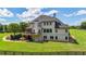 Elegant two-story home with a spacious lawn and a charming deck overlooking the beautiful backyard at 104 Meadow View Trl, Canton, GA 30115