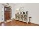 Warm foyer with a wooden front door, stylish console table, and hardwood floors, welcoming you home at 104 Meadow View Trl, Canton, GA 30115