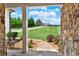 Scenic view from the front porch showcases the professionally landscaped yard and a winding walkway at 104 Meadow View Trl, Canton, GA 30115