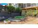 The backyard has tiered metal planters and mulch landscaping around the exterior of the home at 104 Meadow View Trl, Canton, GA 30115