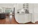 A butler's pantry in white with stone countertops and stainless steel appliances at 104 Meadow View Trl, Canton, GA 30115
