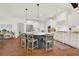 Spacious kitchen with white cabinets, a large island, and modern lighting at 104 Meadow View Trl, Canton, GA 30115