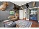 Living room features a cozy sitting area and custom bar, perfect for entertaining guests at 104 Meadow View Trl, Canton, GA 30115