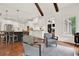 Open concept living room with hardwood floors, and direct access to kitchen area at 104 Meadow View Trl, Canton, GA 30115