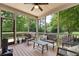 Comfortable screened porch with outdoor seating, perfect for relaxing and enjoying the view at 104 Meadow View Trl, Canton, GA 30115