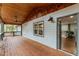 Inviting covered back porch with wood ceiling, ceiling fan and recessed lighting at 2205 Stockbridge Se Dr, Atlanta, GA 30316