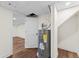 Basement utility area with water heater, and door to the finished section of the basement at 2205 Stockbridge Se Dr, Atlanta, GA 30316