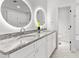Modern bathroom with dual sinks, granite counters, and decorative lighting at 2205 Stockbridge Se Dr, Atlanta, GA 30316