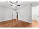 An airy bedroom with hardwood floors, ceiling fan, and neutral paint at 2205 Stockbridge Se Dr, Atlanta, GA 30316