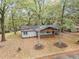 Inviting home with mature trees, a cozy front porch, and well-maintained landscaping at 2205 Stockbridge Se Dr, Atlanta, GA 30316