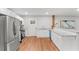 A modern kitchen featuring stainless steel appliances, white cabinets, granite countertops, and an open layout at 2205 Stockbridge Se Dr, Atlanta, GA 30316