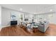 Well-lit living room features modern furniture, stylish decor, fireplace, hardwood flooring, and ample natural light at 2205 Stockbridge Se Dr, Atlanta, GA 30316