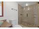 Modern bathroom with a glass-enclosed shower featuring decorative tile accents at 3334 Peachtree Ne Rd # 101, Atlanta, GA 30326