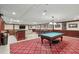 Spacious game room features a pool table, bar, and multiple seating areas for entertainment at 3334 Peachtree Ne Rd # 101, Atlanta, GA 30326