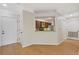 Living room with hardwood floors, view to kitchen and access to other rooms at 3334 Peachtree Ne Rd # 101, Atlanta, GA 30326