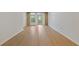 Bright room with hardwood flooring and access to the outdoor balcony at 3334 Peachtree Ne Rd # 101, Atlanta, GA 30326