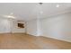 A bright and spacious living area with wood floors and open access to the kitchen at 3334 Peachtree Ne Rd # 101, Atlanta, GA 30326