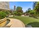 Well-maintained turf area with fountain, seating and lush landscaping for relaxation and enjoyment at 3334 Peachtree Ne Rd # 101, Atlanta, GA 30326