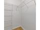 Walk-in closet with built-in shelving and bright white walls, ready for organization at 3334 Peachtree Ne Rd # 101, Atlanta, GA 30326