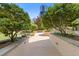 Picturesque walkway flanked by lush greenery and manicured landscaping, perfect for leisurely strolls at 3334 Peachtree Ne Rd # 101, Atlanta, GA 30326