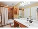 Clean bathroom featuring a shower-tub combo, tiled walls, and a spacious countertop at 401 Kenley Ct, Mcdonough, GA 30253