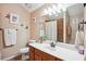 Inviting bathroom featuring a sleek vanity with ample counter space and a framed mirror, paired with a shower-tub combo at 401 Kenley Ct, Mcdonough, GA 30253