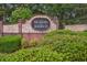 The Meadows at Jodeco brick community sign adorned with lush landscaping for an inviting entrance at 401 Kenley Ct, Mcdonough, GA 30253