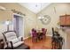 Cozy dining area with seating for six, a chandelier, and easy access to the kitchen at 401 Kenley Ct, Mcdonough, GA 30253