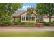 Well-maintained home with mature trees and professional landscaping at 401 Kenley Ct, Mcdonough, GA 30253